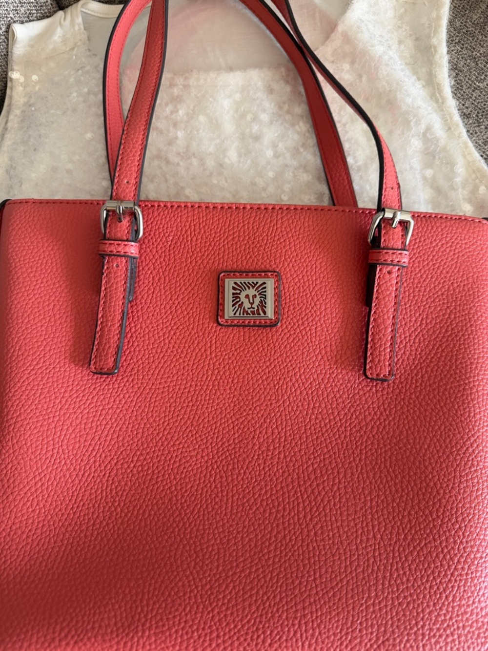 Anne Klein Coral Pebbled Leather Tote with Lion Medallion